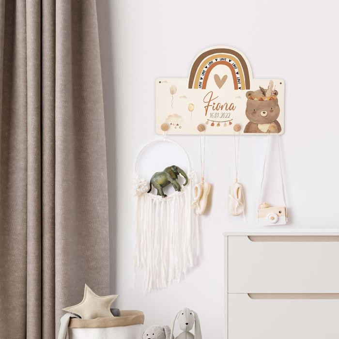 handcrafted wooden coat rack with rainbow and bear design
