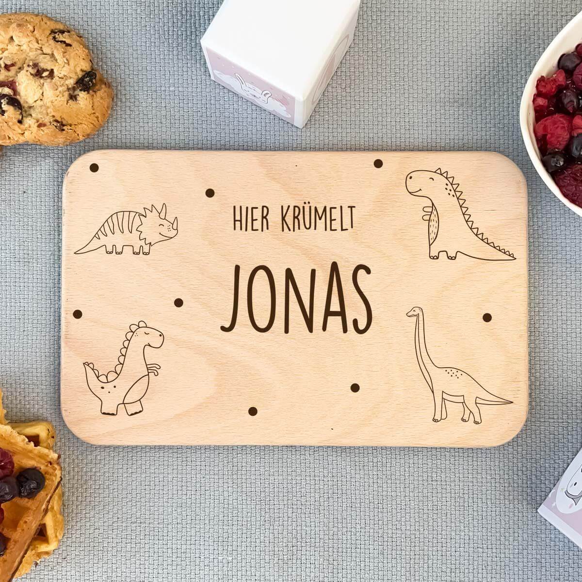 close-up of dinosaur design on personalized breakfast board
